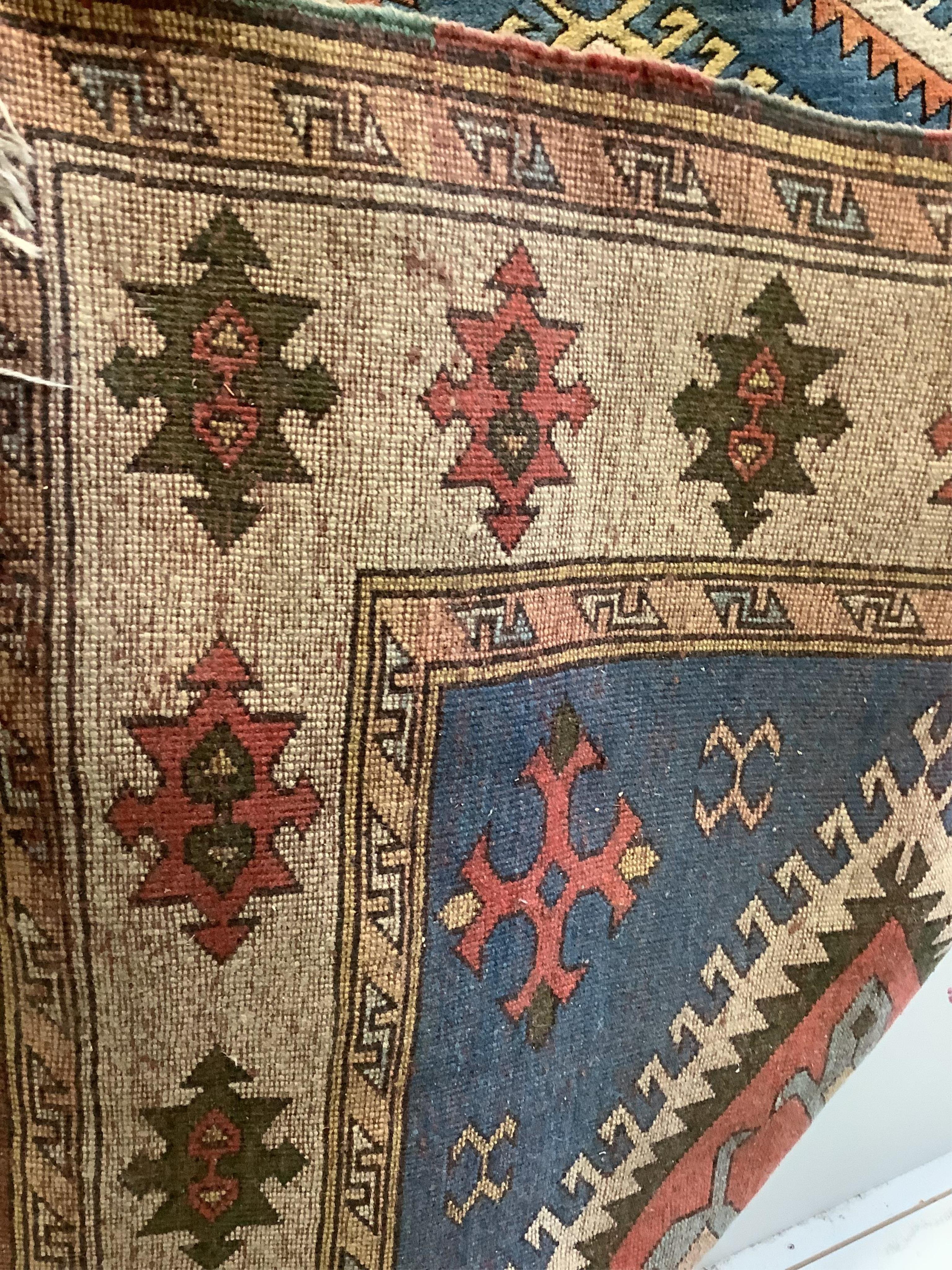 A Caucasian style blue ground rug, 260 x 160cm. Condition - fair